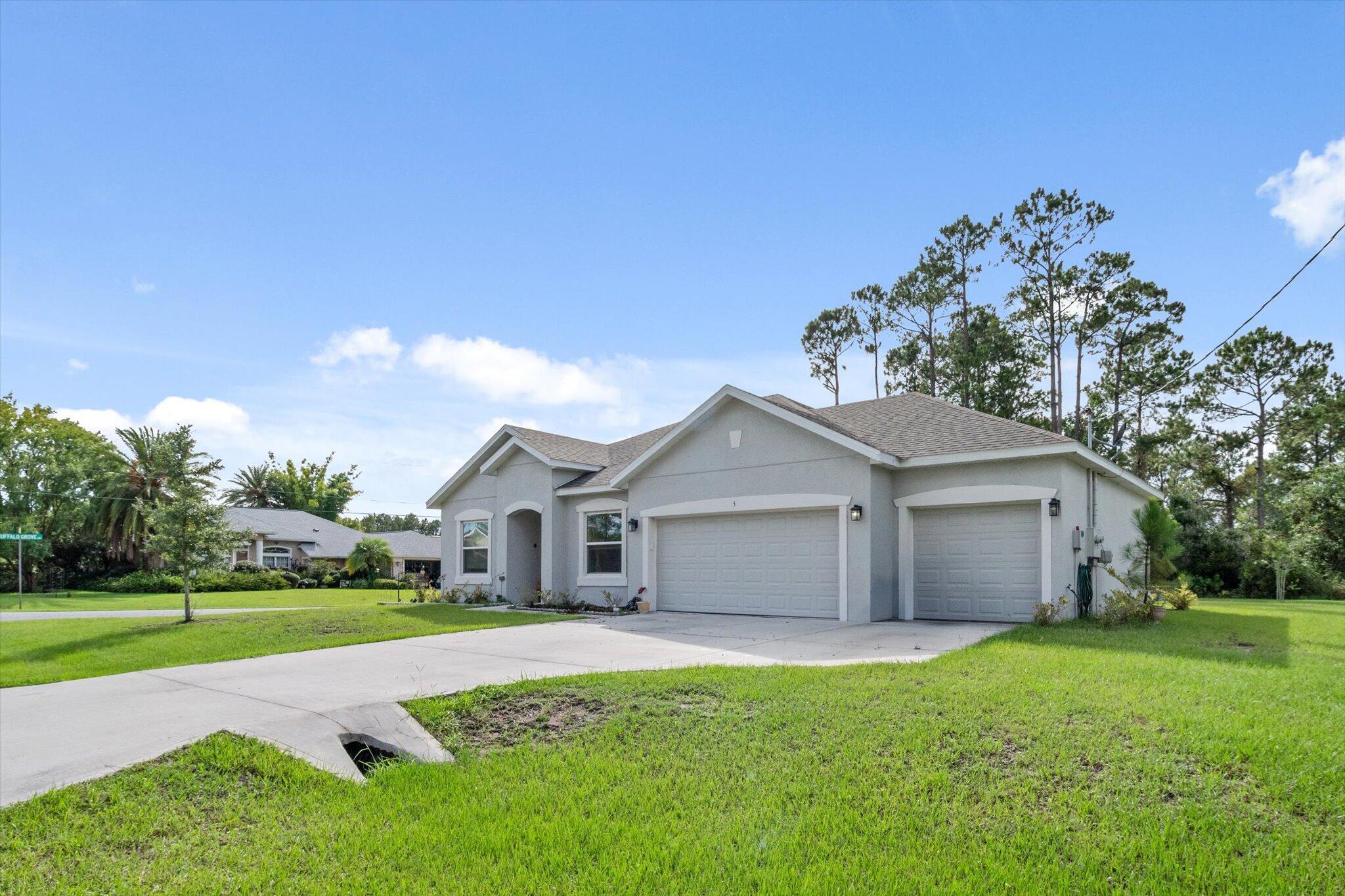 Stunning 2021-built home on a spacious corner lot! This 3-bed, 2-bath gem offers a 3-car garage, dedicated dining room, and flexible office space. The kitchen boasts quartz counters, wood cabinets, stainless steel appliances, and a large island--perfect for entertaining. Enjoy the open-concept family room with high ceilings and natural light. The primary suite features a walk-in closet and dual vanities. Relax on the screened patio overlooking the oversized lot. Close to beaches, schools, parks, shopping, and just minutes to I-95, St. Augustine, Daytona, and Orlando!