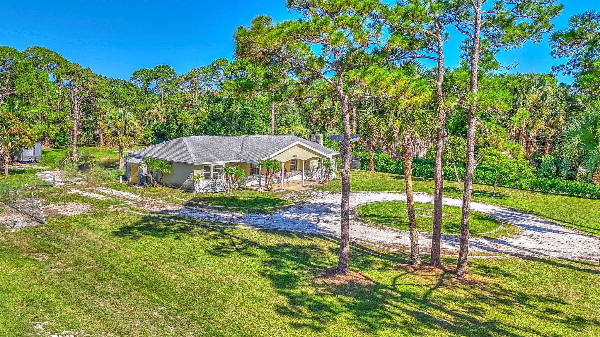 Discover the perfect blend of space, privacy, and versatility with this 4-bedroom, 2-bath home nestled on nearly an acre (.91 acres) in desirable Indian River Estates. Enjoy the Florida lifestyle with an in-ground fiberglass pool with a new pool pump, a peaceful pond, and plenty of room to store your boat, trailer, or RV. The unique layout includes a 4th bedroom just off the primary suite with a private entrance--ideal for a home office, den, or potential rental space.Inside, you'll find tile flooring throughout, a spacious kitchen, stainless steel appliances, and a light-filled layout perfect for everyday living or entertaining. A circular driveway offers a welcoming touch and added convenience.