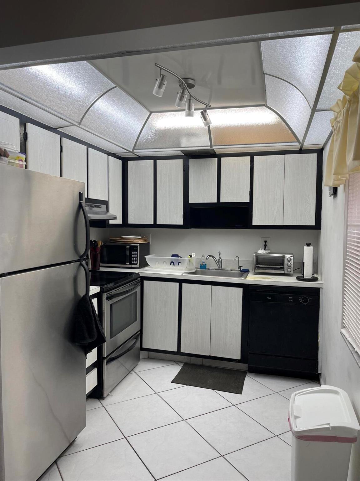 Great opportunity to own a true corner, first floor 2 bedroom condo with a beautiful lake view from your front window! Enclosed side patio with air conditioner opening to garden view. Carrier AC installed this year, instant hot water system, one bathroom remodeled. Extra storage closet added to patio that is enclosed to keep dry and allow you to enjoy during all weather! Investors: This unit may be rented immediately!