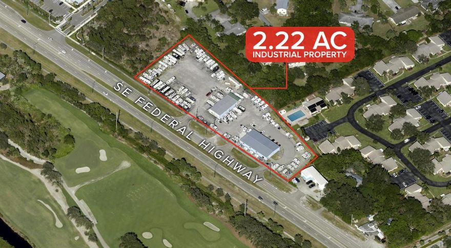 Opportunity to acquire a versatile commercial property along SE Federal Highway in Hobe Sound.
• Site consists of two adjacent parcels totaling ±2.22 acres, each featuring a freestanding warehouse-style building (one 6,000± SF and the other 3,200± SF) utilized as office, sales, and showroom space.
• The buildings feature multiple roll-up doors, open-concept interiors, ample parking and yard space, and the property is fully fenced for added security.
• Formerly used for RV sales, the site is ideal for comparable uses, including vehicle or heavy equipment sales, as well as a variety of commercial and light industrial operations such as distribution, logistics, light manufacturing, sales, or service-based businesses.
• Strategically located with direct frontage and access to US-1