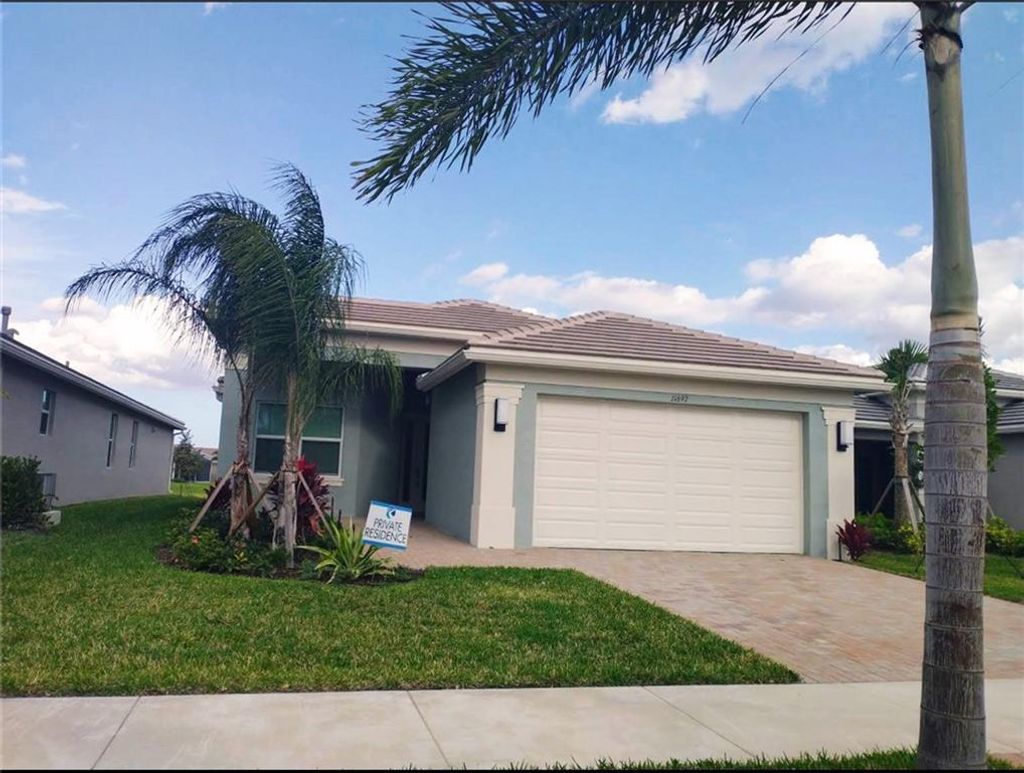 Photo of 11697 SW Moon River Way, Port Saint Lucie, FL 34987 (MLS # F10322617)