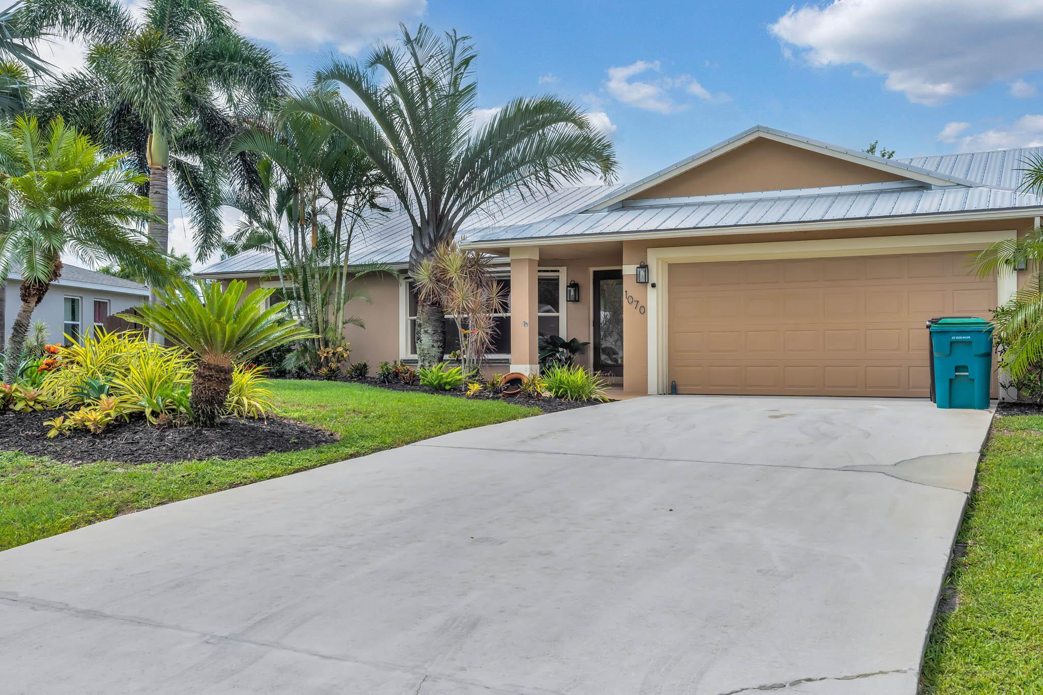 Immaculate 3 Bedroom 2 Bathroom Home Located in Prime Port Saint Lucie Location! NO HOA! NEW METAL ROOF! - 2021. This Spacious Home offers a Split Floor Plan and Plenty of Room for Everyone! The cozy Electric Fireplace offers a Comfy and Charming Vibe Through out. Plenty of Living Area! Large Fenced in Backyard! Centrally Located - Close to Shopping, Tradition, Restaurant's, 95 and the Turnpike!