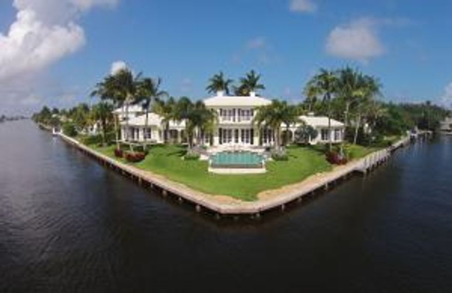 Stunning Bermuda style home in the heart of Gulfstream on a spectacular south point lot!  Enjoy forever views down the Intracoastal! Approximately 6,400 sq.ft. of living area offers 6 BRs,81/2 baths, paneled library, 3bay garage and impact-glass windows.The Grand Foyer is complimented by a graceful staircase leading to 4 guest BRs.with balcony access and water views.The Master suite is on the Main Living level: it boasts His&Her baths plus exercise room.  The ''open'' floor plan showcases the formal LR & DR overlooking the water. A true chef's kitchen adjoins the Family & Breakfast Rooms. Perfect for entertaining. The elegant resort-style patio with infinity-edge pool has two trellis loggias.  The 330' of deepwater offers 150' of protected dockage to accommodate your yacht.