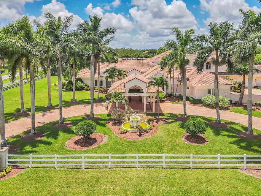 Welcome to this sprawling estate home situated on nearly 2.5 acres in the exclusive Wellington neighborhood of Paddock Park. Convenience, security and comfort is ensured with a Crestron home automation platform. Making this a truly smart home.

Upon entry, be greeted by soaring 28 foot ceilings complete with marble flooring throughout. The family room offers a newly installed wine cabinet, and a stunning custom built wood bar perfect for a game room and hosting large parties.
Offering 6 bedrooms including the oversize primary suite, complete with a luxury spa like en suite with a jet spa tub and pass through shower. Includes gorgeous newly built custom walk-in closets, featuring Rosso Venato Dolomite marble counter-tops from Italy. A new 1,400sq ft luxury theater room with Dolby ATMOS has been installed with state of the art Martin Logan sound system, 180" projection screen with JVC DLA projector and premium seating for 12. Photos coming soon.
Finally, step outside to the extraordinary outdoor living space with a full summer kitchen, brand new three person sauna and fully screened in pool complete with rock waterfalls.



Additional Upgrades Include:
2021 Complete impact windows
2021 4 New AC systems
2021 Upgraded reverse osmosis water system
2021 Exterior gutter system
2021 3 New gate systems
2021 6 New electrical panels
2016 Roof replacement
2016 Screen enclosure installation