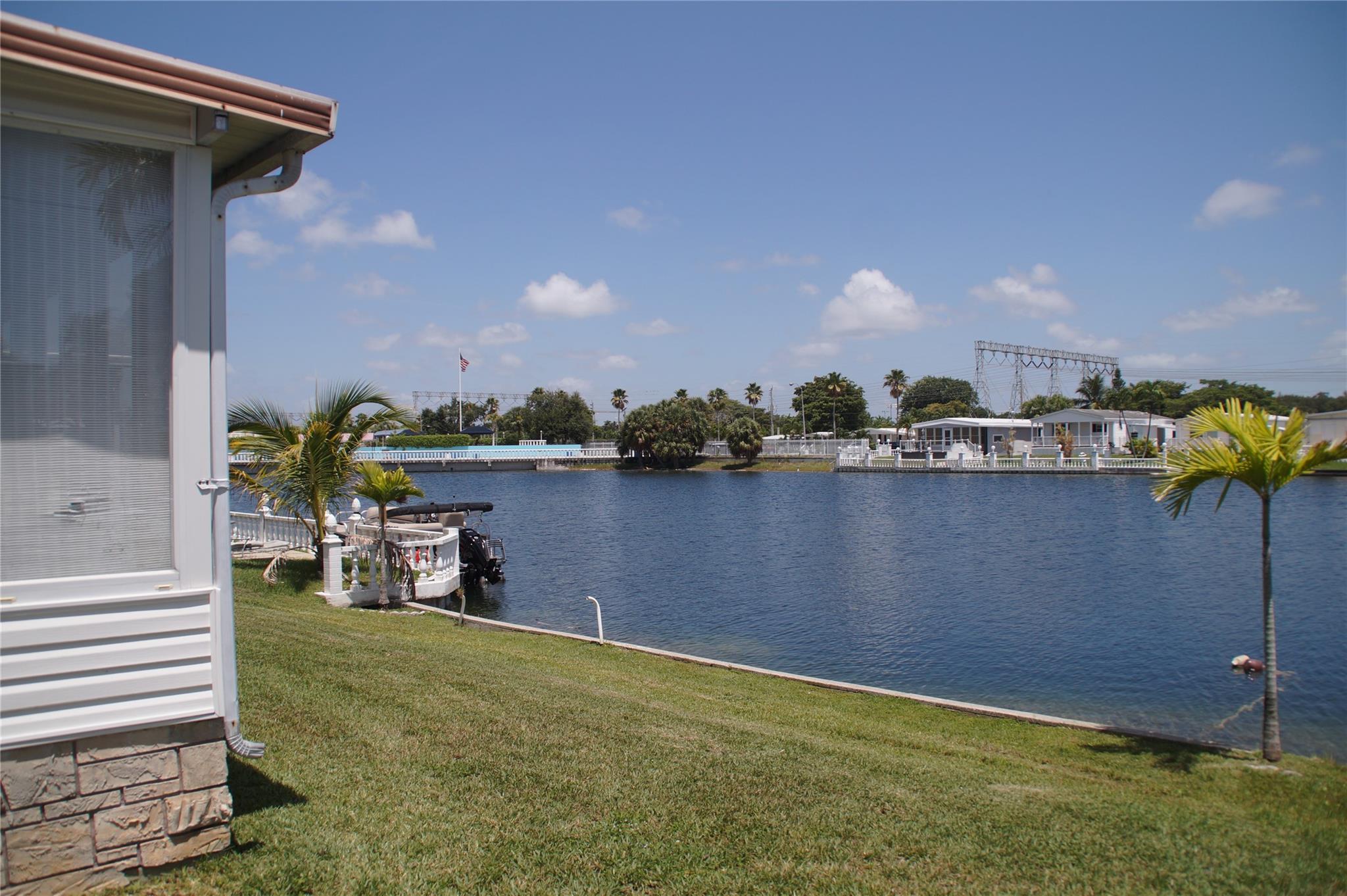 LAKEFRONT LIVING...!!! OWN THE LAND…!!! ENJOY BREATHTAKING VIEWS OF THE WATER RIGHT FROM YOUR DOORSTEP..!! PRICED TO REFLECT THE LAND VALUE...!!!
THIS PROPERTY OFFERS ENDLESS POSSIBILITIES WHETHER YOU'RE INTERESTED IN GIVING THE EXISTING HOUSE A MAKEOVER OR REMOVING IT ENTIRELY TO MAKE ROOM FOR A BRAND NEW HOME. DIRECT ACCESS TO THE LAKE, YOU'LL HAVE YOUR OWN SLICE OF WATERFRONT PARADISE..!!
THE COMMUNITY OFFERS OLYMPIC SIZE SWIMMING POOL, SAUNA, GYM, GOLF, BOWLING ALLEY, LOTS OF ACTIVITIES AND MORE..!! CLOSE TO SHOPPING, HARD ROCK CASINO, 4 MILES FROM THE BEACH AND GREAT RESTAURANTS...!!! VERY LOW MAINTENANCE...!!! SCHEDULE YOUR PRIVATE VIEWING TODAY...!!!