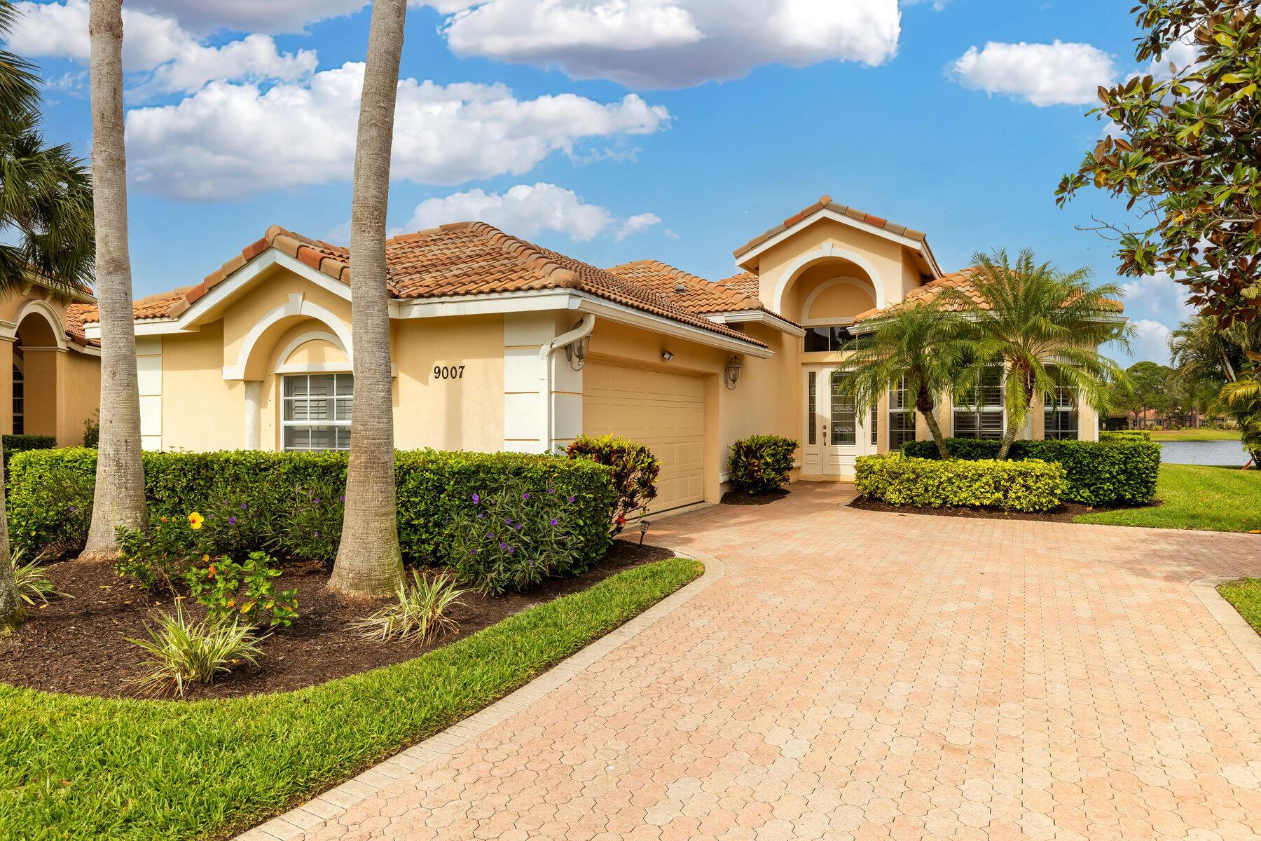 Experience luxury in this stunning pool home with breathtaking LAKE VIEWS! Nestled in a secure, manned-gated community, featuring three championship golf courses. This gem boasts tons of natural light and an array of upgrades. Beautiful NEW AC, new flooring in the bedrooms, soaring ceilings, and an open-concept design, blending comfort and style, with a three way split floor plan. Relax or entertain by the screened-in pool and patio, overlooking the lake. The spacious primary suite offers a private retreat, with direct water views, walk in closets and a oversized 5 piece master bath! Complemented by a convenient 2-car garage. You won't find better than this prestigious golf community with world-class amenities, This home is a rare find!! Don't miss out-- Easy/quick access to I 95.