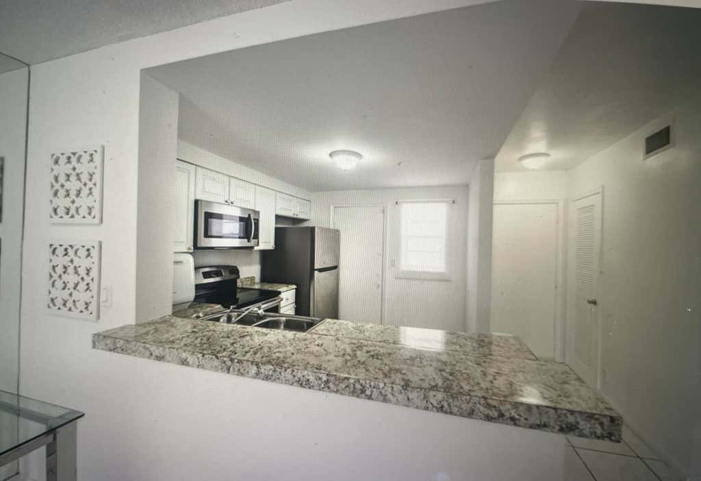 Photo of 501 NE 14TH Avenue #103, Hallandale Beach, FL 33009 (MLS # B26064862)