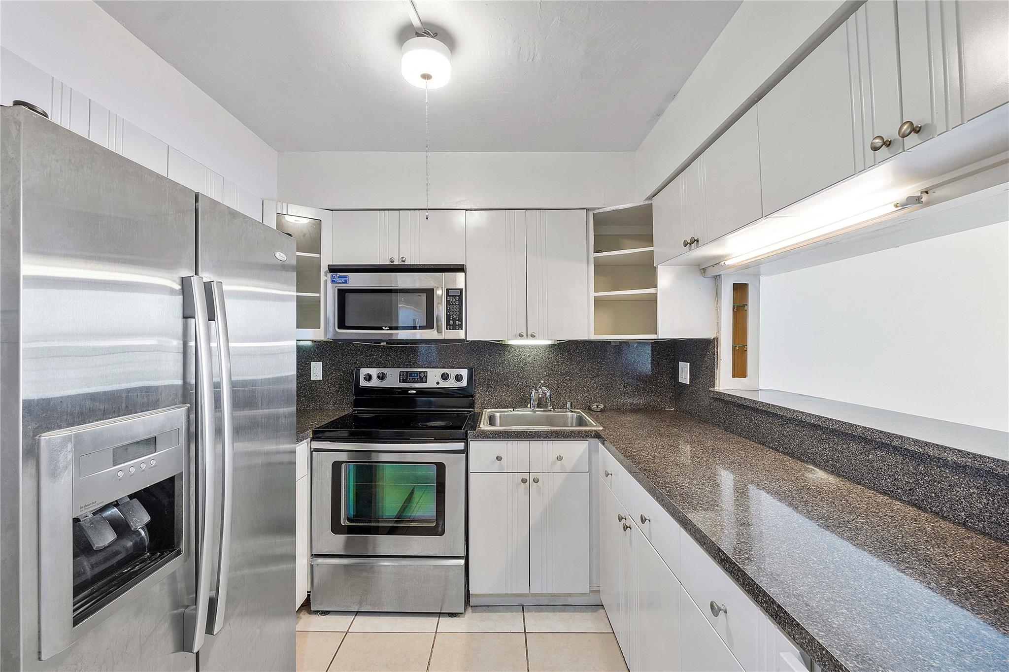 Very nice, well maintained 1 bedroom 1 1/2 bathroom plus den condo in a great community. The den can be used as a second bedroom or an office. Tile flooring throughout. Kitchen features granite countertops and stainless appliances. Top floor unit with large balcony. Washer and dryer inside unit. Community features pool, tennis courts and other amenities. Great location close to shopping, restaurants and highways. Easy to show! Schedule your showing today!