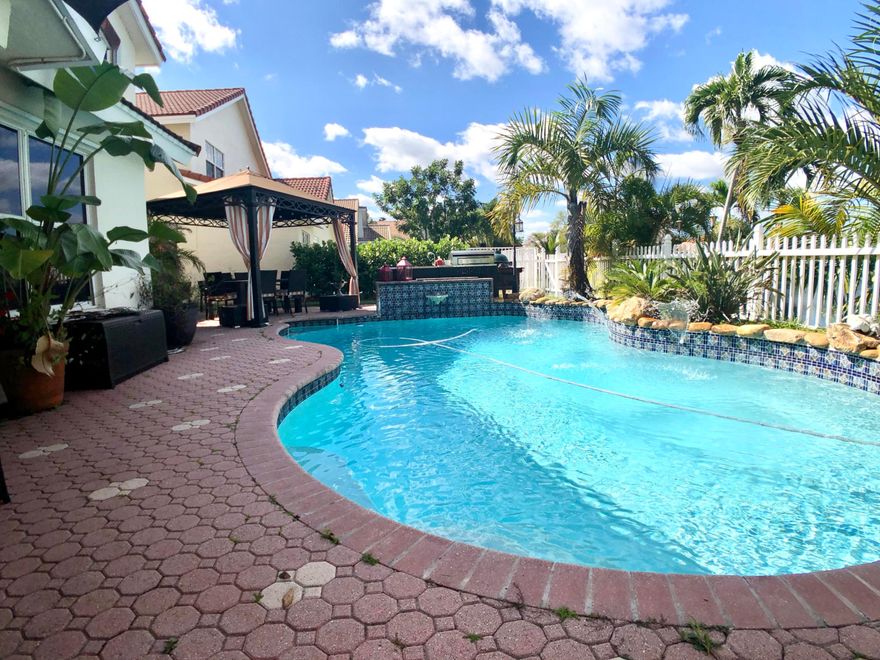 On a tranquil lake in Coral Lake Estates, this 4 bedroom with 2 and 1 half bath house is awaiting a new owner to enjoy all its features! One of those, a sealed lounge, with an exhaust to the exterior of the house, this temperature controlled room also serves as a wine cellar. This 2 story house has tile and wood flooring throughout & a one of a kind glass panel staircase, stainless steel kitchen appliances, AND a Pool! If that wasn't enough Come see it for yourself!