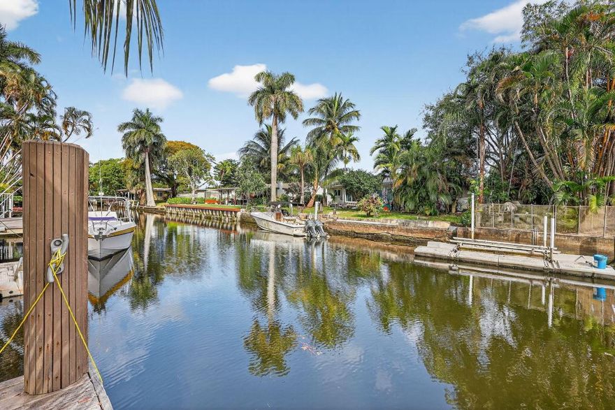 Beautiful and bright ranch home with newer roof replaced in 2025, impact windows/doors, and  stunning canal views from the expansive backyard, featuring a private pool with gorgeous deck, large storage shed, abundant green space and impressive dockage— over 60 feet on one side and over 20 feet on the other along with 30 amp shore power. Ideal for boat enthusiasts.  The home boasts travertine marble floors, granite kitchen counter, upgraded bathrooms, jacuzzi tub, large bedrooms, and a beautiful Florida room.  Airbnb-friendly with no HOA, making this an excellent opportunity for short-term rental or income-producing use. Prime location just minutes from the beach, Hollywood International Airport, and the world-famous Hard Rock Seminole Casino. A must see!