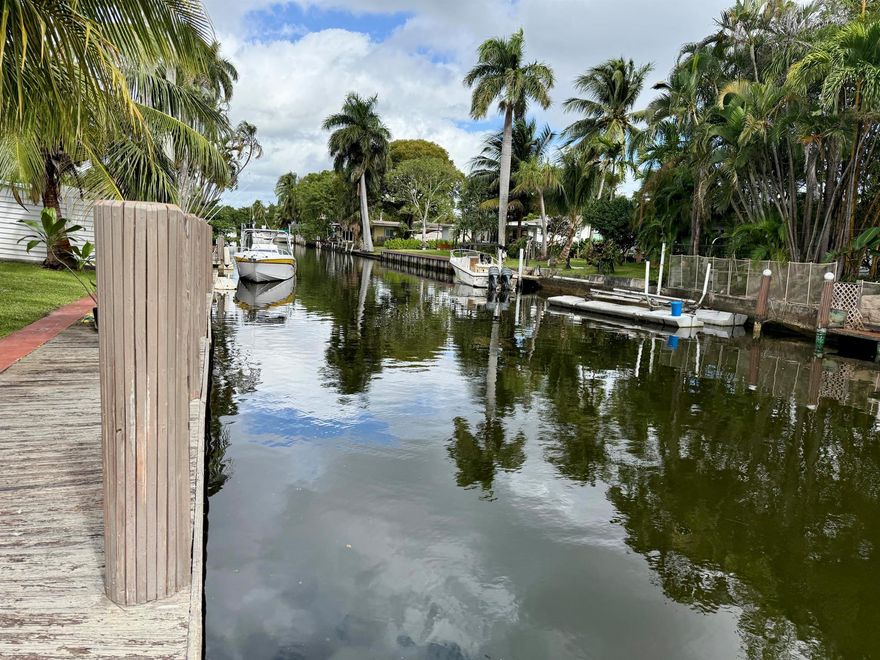Beautiful and bright ranch home with newer roof replaced in 2025, impact windows/doors, and  stunning canal views from the expansive backyard, featuring a private pool with gorgeous deck, large storage shed, abundant green space and impressive dockage-- over 60 feet on one side and over 20 feet on the other along with 30 amp shore power. Ideal for boat enthusiasts.  The home boasts travertine marble floors, granite kitchen counter, upgraded bathrooms, jacuzzi tub, large bedrooms, and a beautiful Florida room.  Airbnb-friendly with no HOA, making this an excellent opportunity for short-term rental or income-producing use. Prime location just minutes from the beach, Hollywood International Airport, and the world-famous Hard Rock Seminole Casino. A must see!
