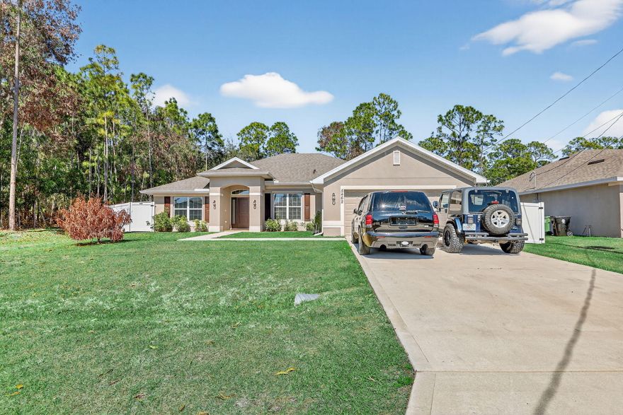 WELCOME TO THIS BEAUTIFULLY BUILT 2022 SINGLE FAMILY RESIDENCE OFFERING 4 BEDROOMS,3 FULL BATHS, A 2-CAR GARAGE,AND A 4 CAR DRIVEWAY. ,PERFECTLY POSITIONED ON A PRIVATE PRESERVE LOT COMPLETE WITH A NEW 6 FOOT WHITE PRIVACY FENCE.WITH 2265 SQUARE FEET OF LIVING SPACE(3100 TOTAL)THIS THOUGHTFULLY DESIGNED 3 WAY SPLIT HOME INCLUDES A FLEX ROOM, ADDING TO THE SPACIOUS AND FUNCTIONAL LAYOUT IDEAL FOR BOTH EVERYDAY LIVING AND ENTERTAINING AND THERE IS NO HOA TO WORRY ABOUT! BRIGHT OPEN KITCHEN WITH AMPLE 36 INCH CABINETRY,SLEEK STAINLESS STEEL APPLIANCES,AND A CONVENIENT BREAKFAST BAR AND BREAKFAST NOOK. OPEN CONCEPT LIVING AND DINING SPACES ARE PEFECT FOR FAMILIES AND GUESTS.TASTEFULLY UPDATED WITH MODERN FINISHES THROUGHOUT INCLUDING HIGH CEILINGS AND LARGE WINDOWS THAT ALLOW NATURAL LIGHT TO  FLOOD THE SPACE. THE EXPANSIVE PRIMARY SUITE INCLUDES DUAL WALK-IN CLOSETS, SEPARATE HIS AND HERS VANITIES, AND A LUXURIOUS SPA-LIKE BATHROOM FEATURING A LARGE SOAKING TUB AND AN OVERSIZED SEPARATE SHOWER. THE MODERN GREAT ROOM IS THE CENTER OF THE HOME, AND IT ADJOINS THE FORMAL DINING AREA AND UTILITARIAN FLEX ROOM WHICH CAN BE USED AS A DEN, OFFICE, OR SITTING ROOM. A SPACIOUS DOUBLE CAR GARAGE INCLUDES A MINI SPLIT A/C FOR YOUR COMFORT AND CEILING RACKS FOR EXTRA STORAGE. THE OWNER IS GRACIOUSLY INCLUDING THE BRINKS ALARM SYSTEM WITH SENSORS ON ALL WINDOWS AND DOORS, AS WELL AS 10 SWANN SECURITY CAMERAS WITH A DVR. THE LONG COVERED PATIO OVERLOOKS THE TRANQUIL YARD WITH LUSH GREENERY,  SERENE VIEWS OF THE PRESERVE,  NO REAR NEIGHBORS, AND SOLAR LIGHTS ALL ALONG THE NEW PRIVACY FENCE.  NESTLED IN A QUIET, FAMILY FRIENDLY NEIGHBORHOOD WITH EASY ACCESS TO LOCAL SCHOOLS, SHOPPING, AND MAJOR HIGHWAYS. LOCATED JUST MINUTES FROM THE AREA'S LARGEST COMMUNITY PARK, AND CLOSE TO CLOVER PARK, THE SPRING TRAINING HOME OF THE NEW YORK METS, THIS HOME OFFERS THE PERFECT BALANCE OF PRIVACY AND ACCESSABILITY. WHILE YOU LIVE APART FROM THE HUSTLE AND BUSTLE, YOU ARE VERY NEAR RESTAURANTS, SHOPPING CENTERS, ENTERTAINMENT, BEACHES, AND GOLF COURSES. YOUR PUBLIX IS THE PUBLIX AT SAINT ANDREWS, ALONGSIDE PNC BANK, A NAIL SALON, CUBAN RESTAURANT, MCDONALDS, DUNKIN DONUTS, SUBWAY, AND A DOLLAR STORE. THE POPULAR TRADITION ALSO AWAITS YOU, WITH ALL TYPES OF EVENTS , FARMER'S MARKETS, RESTAURANTS AND FACILITIES. CULTURAL ATTRACTIONS INCLUDE THE BOTANICAL GARDENS AND WILDLIFE CENTER. DON'T MISS THIS OPPORTUNITY TO OWN A NEWER CONSTRUCTION HOME IN A PRIME AND GROWING LOCATION WHERE YOU CAN LIVE AS PEACEFULLY OR ACTIVELY AS YOU WISH,  A CONVENIENT CABANA BATH PROVIDES EASY ACCESS FOR GUESTS AND FUTURE OUTDOOR LIVING ENHANCEMENTS AS ADDING A POOL. TWO BEDROOMS ARE LOCATED NEAR THE CABANA BATH AND THE THIRD IS ON THE OTHER SIDE OF THE KITCHEN, NEXT TO ANOTHER FULL BATH AND THE LAUNDRY ROOM WITH STORAGE. MAKE THIS ALMOST NEW HOME YOUR OWN.