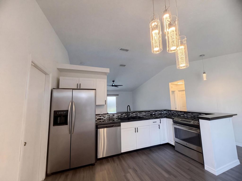 Photo of 681 SW Mccoy Avenue, Port Saint Lucie, FL 34953 (MLS # R11163957)