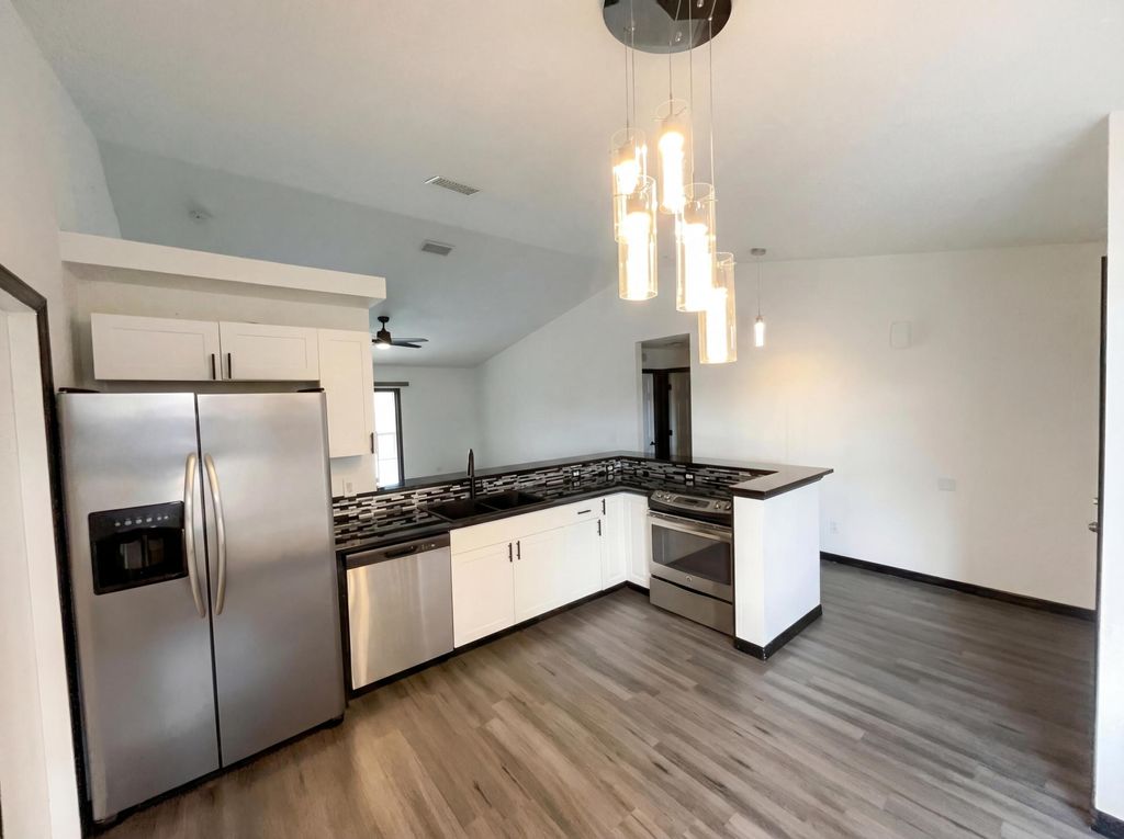 Photo of 681 SW Mccoy Avenue, Port Saint Lucie, FL 34953 (MLS # R11163957)