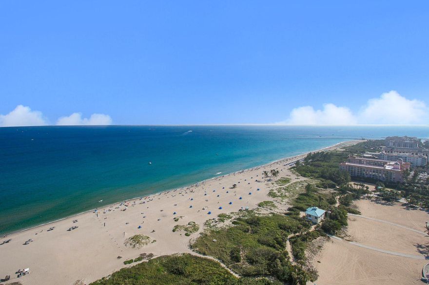 This gorgeous 3 bedroom, 3 and a half bath, plus den Ritz Carlton Luxury Residence features the most amazing unobstructed coastline views of the ocean, beach and Intracoastal Waterway as far as you can see south to the Breakers Hotel. This residence offers the best of everything including 9' 4" ceilings, private elevator foyer, 9' hurricane impact sliding doors and balcony railings, all solid core doors and a reverse osmosis water filtration system throughout the unit. Beautiful limestone flooring in all main living areas with intricate tongue and groove white ceiling work and custom lighting. The gourmet kitchen has a large chef's island with all custom Italian cabinetry, stone tops including a white quartz waterfall edged bar with large (See Supplement)...