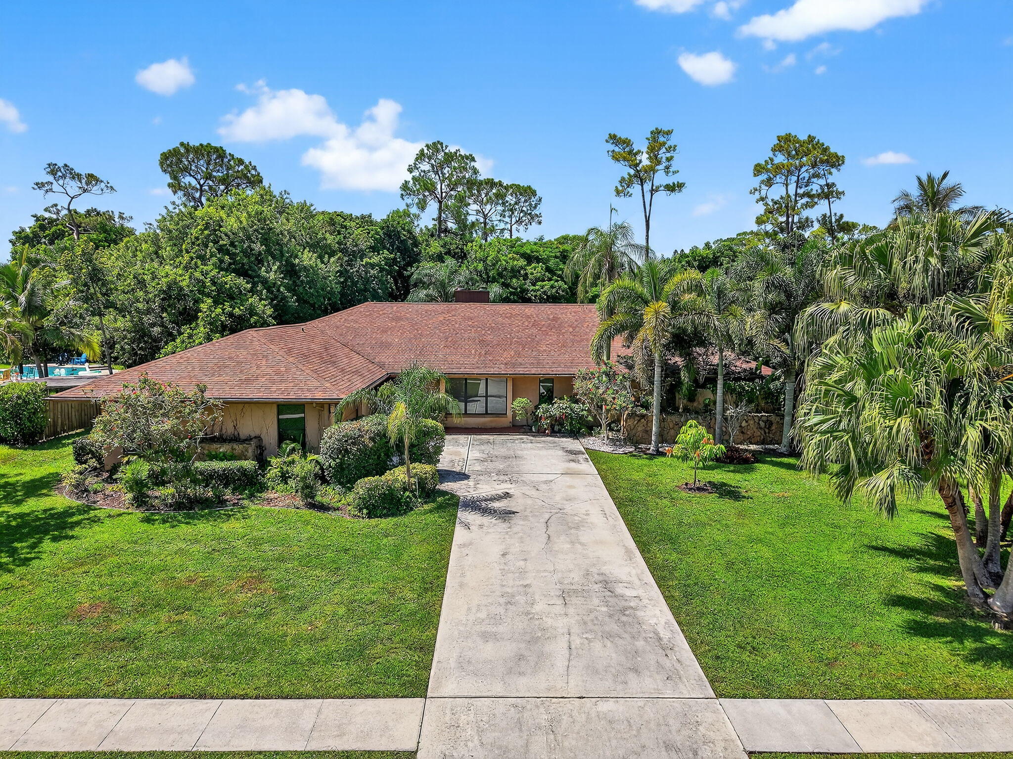 Unlimited potential to make this your forever home!Sprawling 5BR/2.5 BA pool home on 1/2 acre with NO HOA-Split BR plan w/large island kitchen & breakfast room, Family Room + Game Room & bar-Large fenced backyard with oversized pool & covered patio with plenty of space to play and store your boat or RV-Features include newer roof (2021), triple split A/C, 2 sided fireplace, sprinkler on well, French doors + oversized garage-EZ to show-Quick occupancy! All meas.approx. PHOTOS WITH FURNITURE ARE VIRTUALLY STAGED