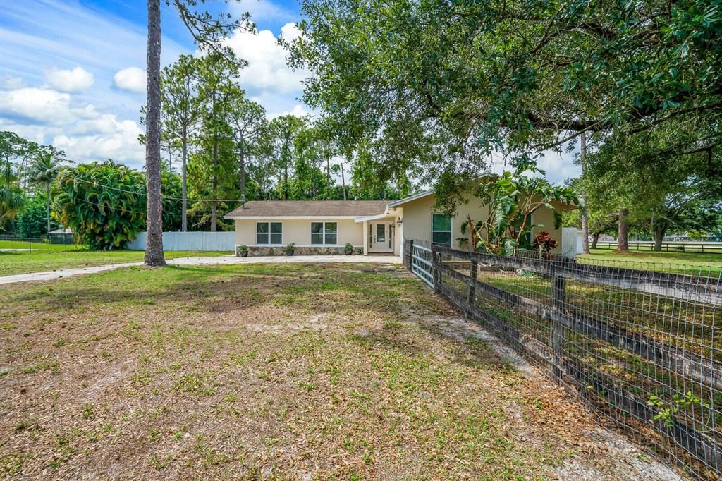 Photo of 16790 E Grand National Drive, The Acreage, FL 33470 (MLS # R10885951)