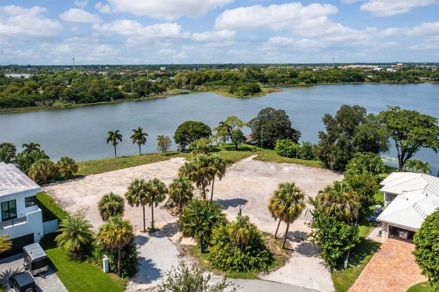 Waterfront point property on Lake Ida in Delray Beach. 360 feet of waterfront on two sides. Almost 1 acre of land. West and northern views span the heart of Lake Ida backed by a preserve with gorgeous susnsets. Lakefront along the west shoreline is 203 feet. Lakefront along the north shoreline is 157 feet. Unity of title can be dissolved to create two waterfront lots each over 1/3 of acre. Prime location just two miles from Delray Beach's famed Atlantic Avenue and it pristine beach. Live the Floridian dream lifestyle!