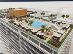 Fabulous building smack in the middle of the Galt Ocean Mile on the Beach-Corner unit has lots of windows and is light and bright-spacious room sizes and large closets-luxury vinyl floor - Building has brand new rooftop pool with expansive views !