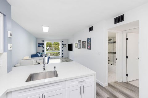 Photo of 2106 S Cypress Bend Drive #207, Pompano Beach, FL 33069 (MLS # B26082703)