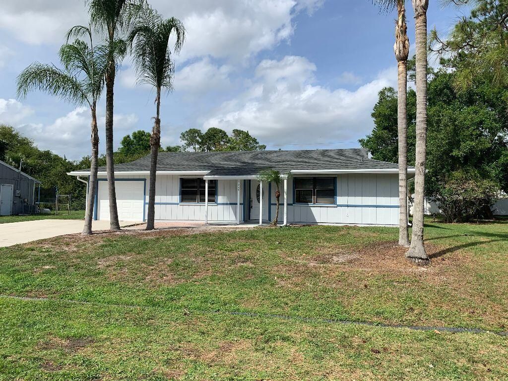 Photo of 1049 SW Eureka Avenue, Port Saint Lucie, FL 34953 (MLS # R10787134)