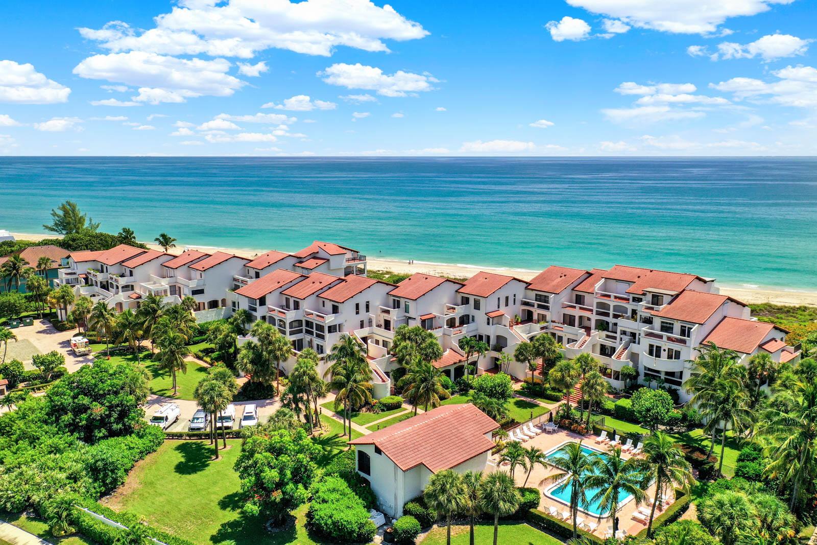 THE DUNE CONDOMINIUM ON HUTCHINSON ISLAND - very rare, two-level townhome with Ocean views and nearly 3000 square feet of finished living space. Features include: complete impact exterior sliders and windows, built-in decorative fireplace, under building parking, 4 outdoor terraces and 1 sunroom/enclosed patio, making the total square footage of nearly 4,000 square feet! The entire upstairs is a 2-room primary suite with a separate living area, has vaulted tongue and groove ceilings, 2-open aired terraces overlooking pool and Ocean. AC system on order. Community amenities include: gated, pool, tennis/pickleball, grill area and dune walk to beach. MIRS and SIRS have been completed. Special assessment TBD for cooling tower. All sizes, taxes, descriptions and HOA