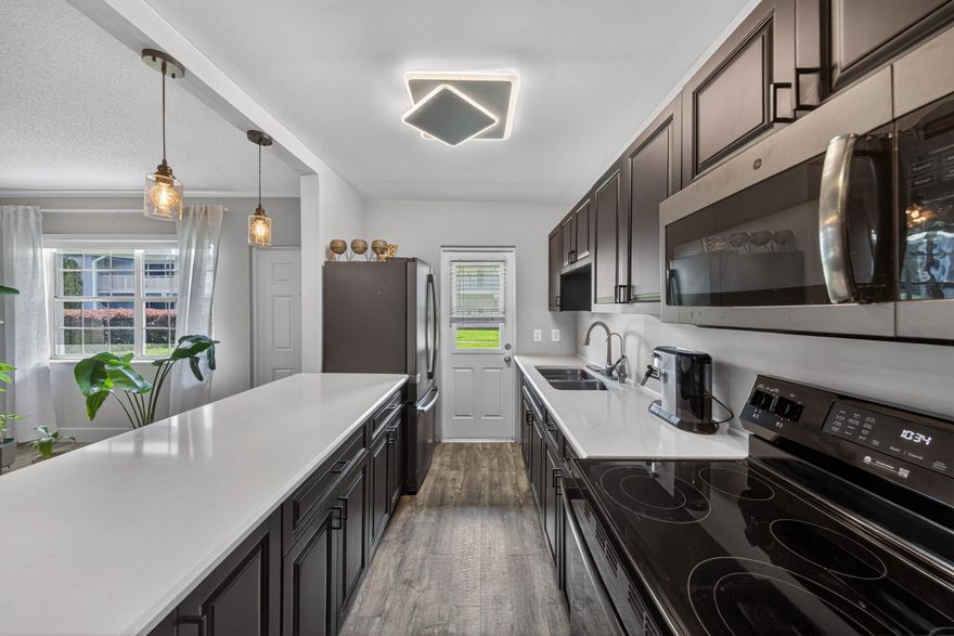 Perfectly Located in Lighthouse Point & positioned just east of US-1, this remodeled 1st floor condo in the all-ages community of Ashley Arms offers the chance to own a move-in-ready gem in one of Broward County's most desirable locations. Thoughtfully renovated for modern elegance and comfort-remodeled kitchen with open bar area, remodeled Bathroom with Shower-only & passthrough entry to the Bedroom, Stylish vinyl flooring throughout, New A/C, water heater, and electrical service 2024/2025 Spacious bedroom with two closets. Assigned parking space right outside the bedroom window, Community pool - just steps from your door.  New roof, railings,Concrete restoration,Fresh exterior paint,Security cameras installed. See supplemental Remarks section for additional information. Prime Location Less than 10 minutes to the beach,Approximately 20 minutes to Fort Lauderdale-Hollywood International Airport,Quick access to I-95 and the Brightline train service,Near FAU, dining, parks, and retail,Close to the Hillsboro Lighthouse and Lighthouse Point Marina. The community welcomes cats, small dogs, and pet birds, and allows leasing after two years of ownership. This condo stands out as one of the most affordable non-55+ options east of US-1 across Palm Beach and Broward Counties. Don't miss this opportunity to own an updated, affordable condo in a prime location—schedule your viewing today.