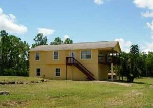 NICE 3/2 HOME IN THE ACREAGE WITH LOTS OF YARD SPACE AND BONUS 2BR 1 BATH UNIT ON BOTTOM FLOOR WITH ITS OWN KITCHEN. TOP FLOOR IS COMPLETELY SEPARATE FROM BOTTOM. BUILT LIKE DUPLEX, JUST NOT SIDE BY SIDE. NICE BALCONY OFF DINING AREA. READY TO MOVE IN. WASHER AND DRYER, SMALL PET OK. ONE LIGHT AND WATER METER FOR THE ENTIRE BUILDING. READY FOR MOVE-IN.