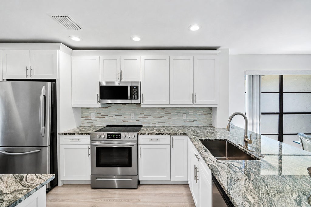 Photo of 21 Southport Lane #B, Boynton Beach, FL 33436 (MLS # B26089752)