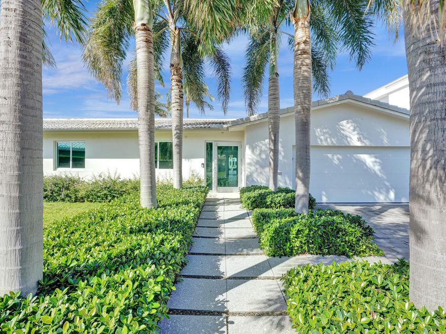 RARELY AVAILABLE POINT LOT IN HIGHLY DESIRABLE BERMUDA RIVIERA! One-of-a-kind home featuring approx. 140' on the Intracoastal & 51.9' on the canal! Build your dream home on this oversized 14,661 SF lot or add to the existing 3 bed, 2 bath newer construction modern minimalist home. Ultra contemporary walnut concealed kitchen w/ Miele & Thermador appliances! Open floor plan w/ floor-to-ceiling impact sliders allowing panoramic views to watch yachts go by & enjoy from your private backyard w/ pool! NEW concrete dock! High-end European fixtures & electric shades thru/out! Fully controllable remotely via phone or ipad! Short walk to Fort Lauderdale Beach, restaurants & shopping! One entrance guardhouse! Home being sold completely turn-key! A true must see! COMPETITIVELY PRICED TO SELL!