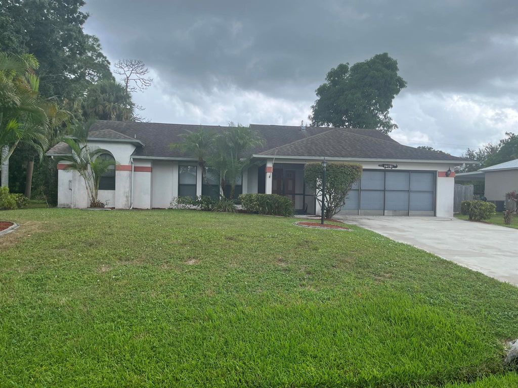 Photo of 2361 SW Woodridge Street, Port St Lucie, FL 34953 (MLS # R10910782)