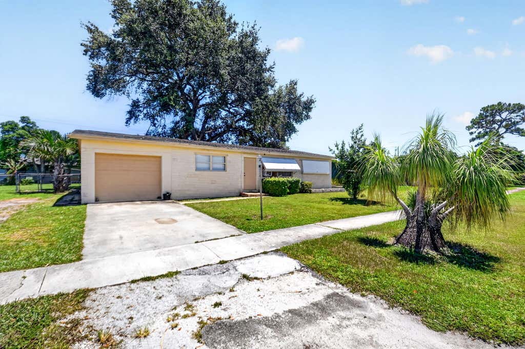 Photo of 1572 Woodland Avenue, West Palm Beach, FL 33415 (MLS # B26063363)