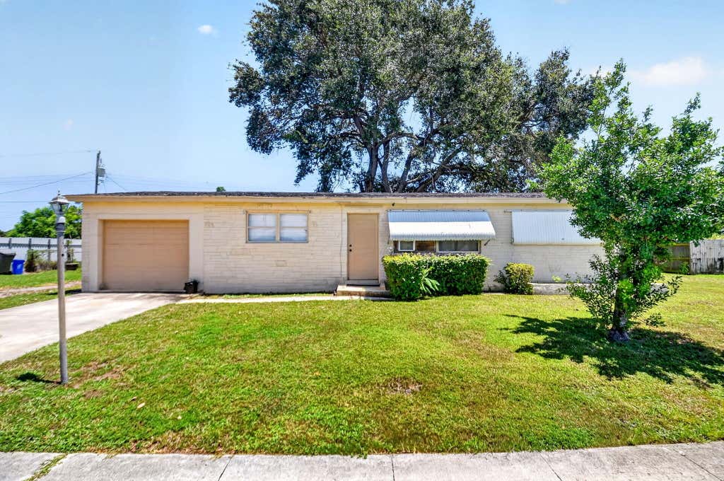 Photo of 1572 Woodland Avenue, West Palm Beach, FL 33415 (MLS # B26063363)