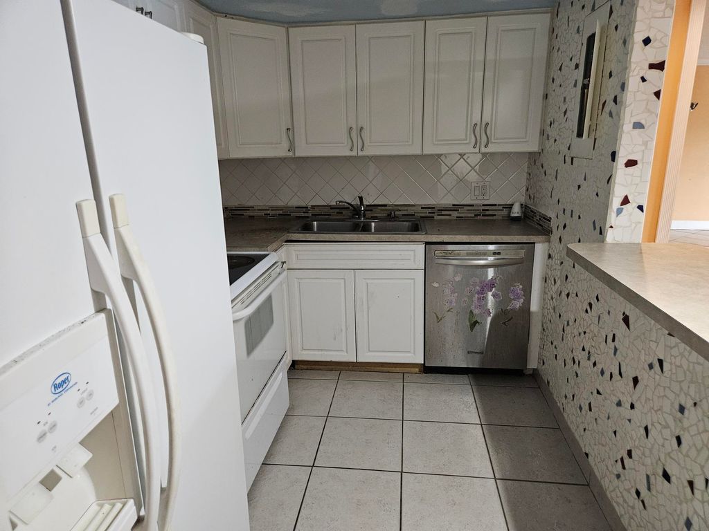 Photo of 5570 NW 44th Street NW #107a, Lauderhill, FL 33319 (MLS # B26007275)