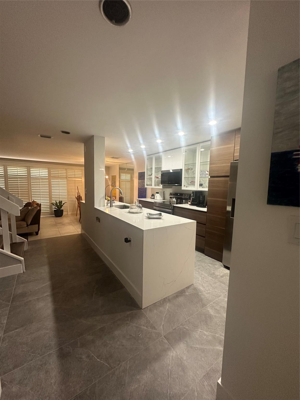 Beautifully remodeled 2-story townhouse in Plantation. Features 3 bedrooms plus a converted garage that can be used as an additional bedroom, office, playroom, or guest space. The home boasts modern finishes, updated kitchen, and renovated bathrooms. Located in a quiet and family-friendly community with excellent schools, close to shopping, dining, and with easy access to major roads. Move-in ready!