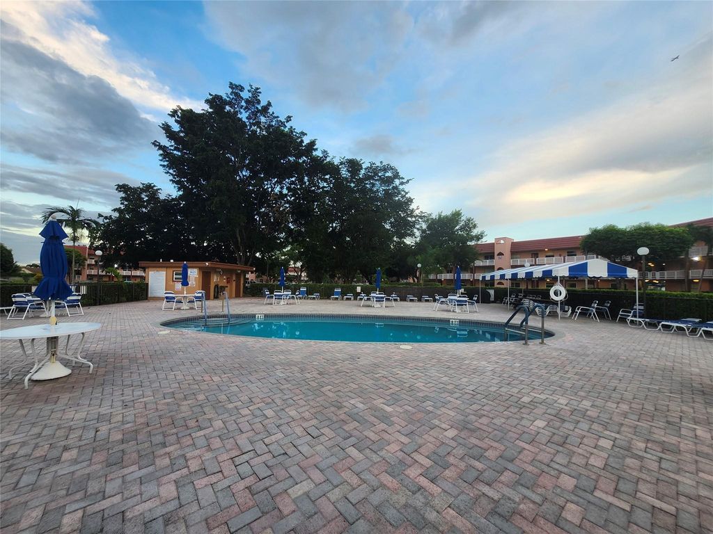 Photo of 9661 Sunrise Lakes Blvd #302, Sunrise, FL 33322 (MLS # F10532519)