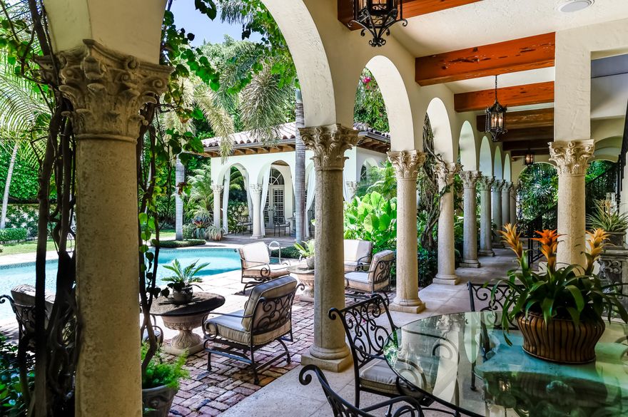 The epitome of Palm Beach's grace and beauty, this Venetian-Inspired villa is situated on Prestigious El Vedado Road, one of the three streets of the Estate Section called the Elegant Els sought after for their historic character, seclusion, and prime in-town location near world famous Worth Avenue. Designed around a magnificent courtyard the well-proportioned floor plan of 12,600+/- sq ft provide eight bedrooms and eight and a half-baths which include the staff quarters and a separate guest house/cabana. French doors across both sides of the L-shaped layout open up the interiors to loggias that surround the courtyard, making outdoor entertaining a way of life in this idyllic oasis of tranquility. Other features, include an elevator and three-bay garage.