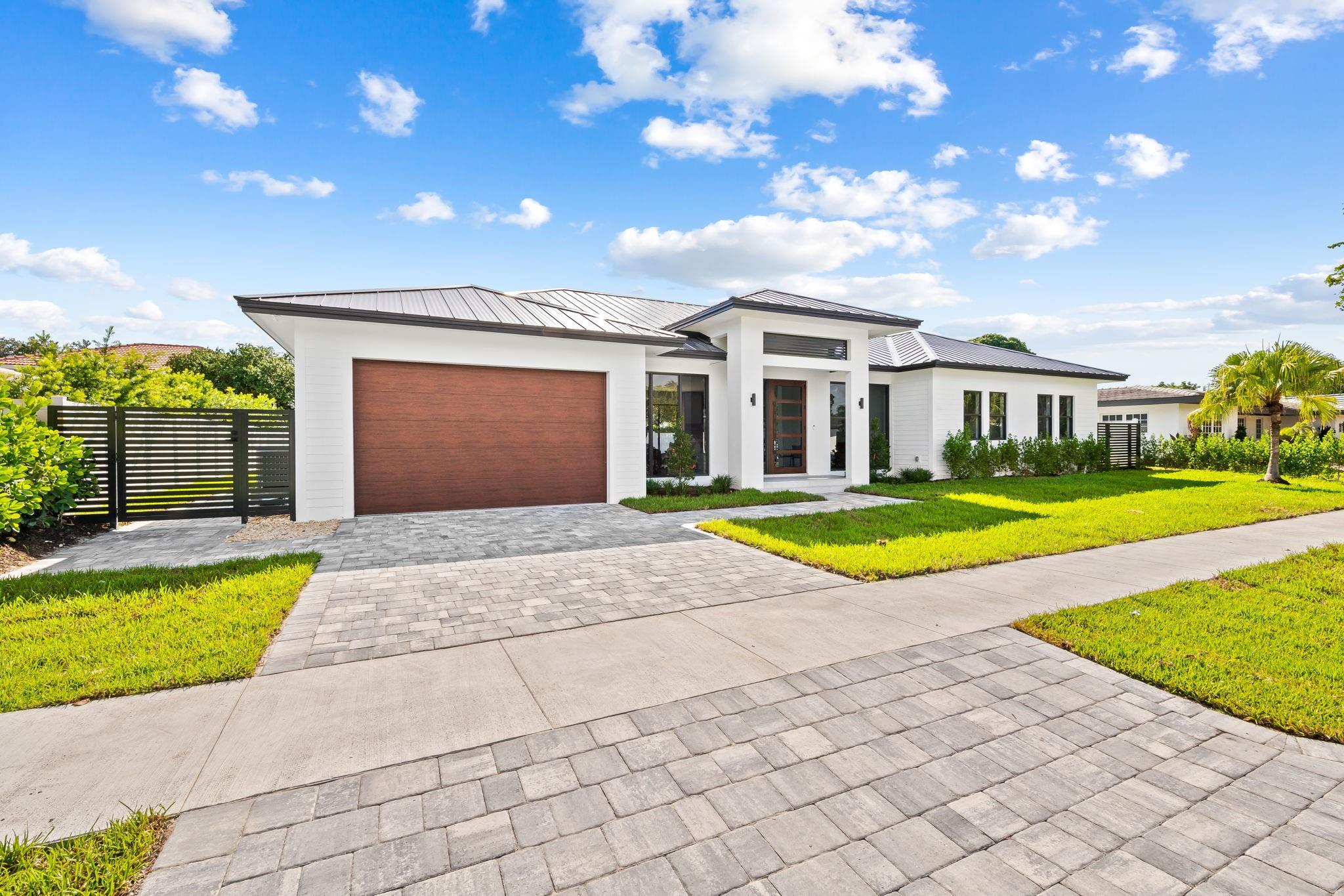 Discover unparalleled modern luxury in Coral Ridge Country Club with this exceptional new construction home offering 3,150 sqft of thoughtfully designed living space. Featuring 4 spacious bedrooms + office and 4 exquisitely appointed bathrooms, this home perfectly blends contemporary style with functional design. The open-concept layout connects a designer kitchen with Thermador appliances to living areas framed by expansive glass sliders, seamlessly merging indoor and outdoor spaces with views of the backyard and sparkling pool with sun shelf. The split floor plan ensures privacy, with an oversized master suite offering direct pool deck access, creating a serene retreat. A spacious office adds flexibility, while a dedicated laundry room enhances functionality.