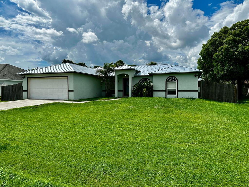 Photo of 385 SW Nativity Terrace, Port Saint Lucie, FL 34953 (MLS # R11011225)