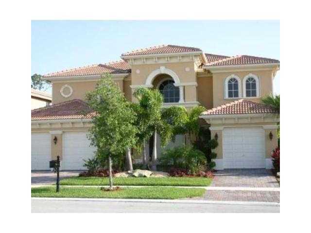 *new photos coming* Welcome to prestigious, Wellington View! Situated in manned gated community w/clubhouse, this impressive estate home offers an open floor plan with a dramatic double staircase and soaring ceilings that create an immediate sense of grandeur. Owner in process of installing new wood vinyl flooring. The kitchen is a chef's delight, featuring sleek granite countertops,newer appliances,spacious breakfast bar, & sun-filled breakfast nook. Enjoy the expansive private pool, covered patio, cabana bath, and fully fenced yard--your secluded oasis for relaxation and entertaining. The primary suite, 3 additional bedrooms plus huge loft area are located upstairs plus 1 additional bedroom and office/6th bedroom downstairs with private bath. Owner is including lawn & pool service