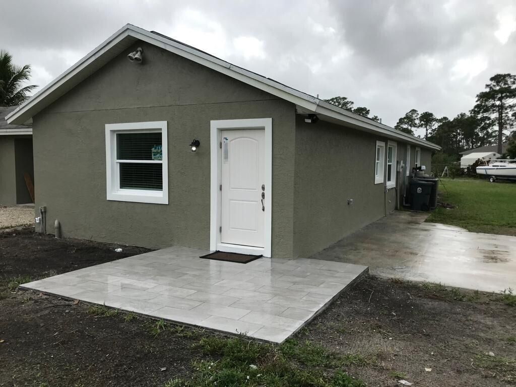 Photo of 17024 N 89th Pl Place N #Apt A, The Acreage, FL 33470 (MLS # B26011244)