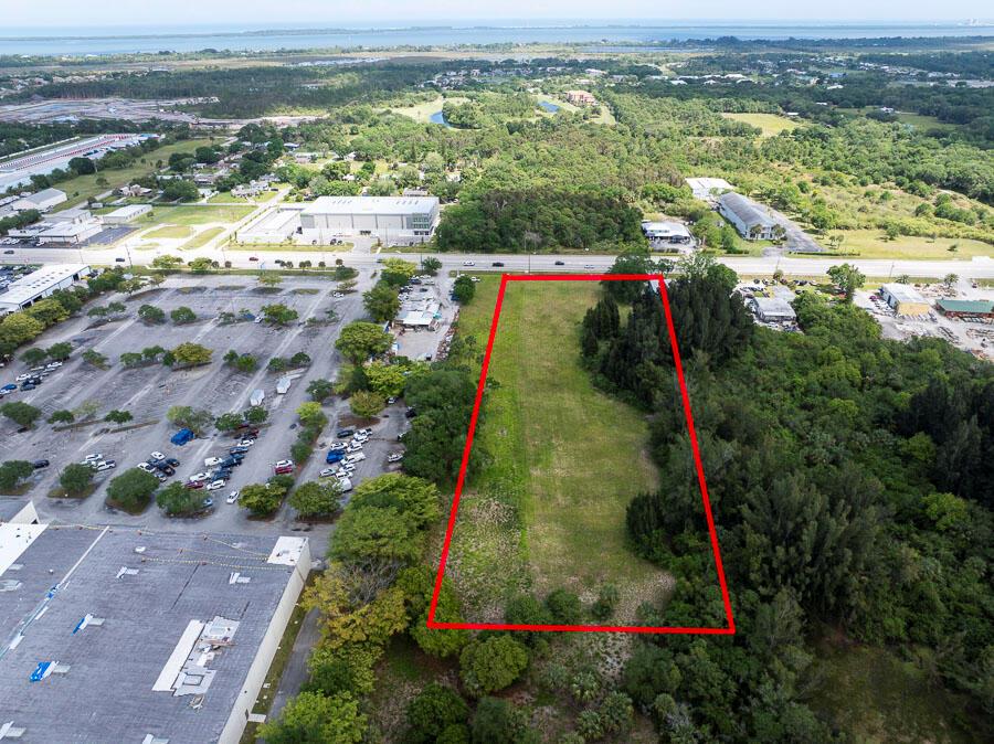 Prime US #1 Development Site. 3 acres with 180 feet on South US #1. This site is high & dry and mostly cleared. Average daily traffic count in front of this property is 30,741 cars per day! Lots of new development in this area of South Fort Pierce including the new Kolter Development just 1/2 mile north on US #1. Over 600 new homes on 130 acres.See Survey and Topo under documents tab.12 inch water main on East side of US #1 and 8 inch sewer force main also on East side of US #1. City natural gas line in front of the property(see utilities map under documents tab).