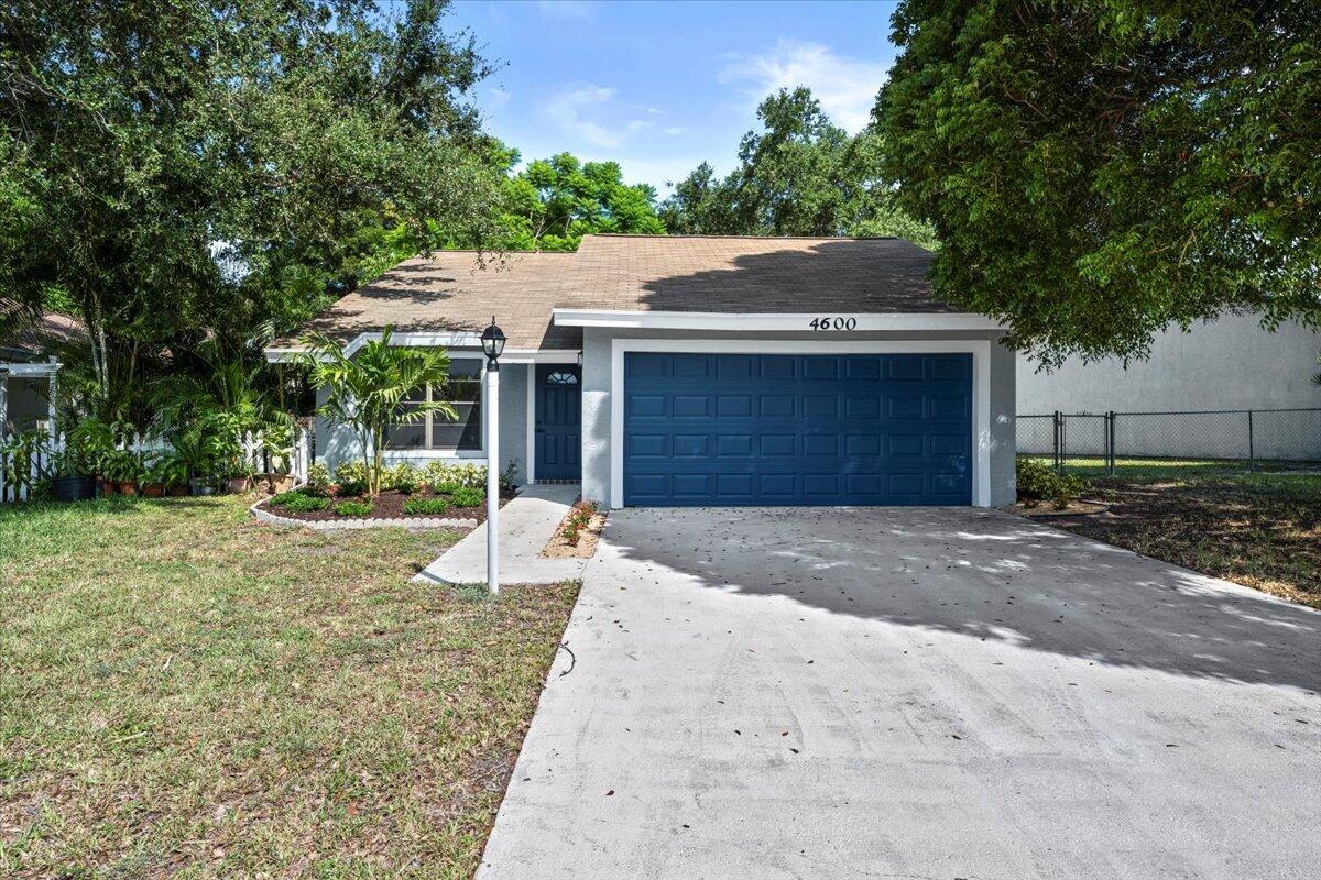Welcome to this beautifully updated 3-bedroom, 2-bath home with a 2-car garage, ideally located in West Palm Beach. Step inside to discover a bright and open layout featuring luxury vinyl flooring throughout and a stylish new kitchen with stainless steel appliances, quartz countertops, and a sleek tile backsplash. Both bathrooms have been fully renovated with designer finishes, including custom tile work that adds a modern and upscale touch. This move-in ready home combines comfort and style in one of Palm Beach County's most desirable areas--don't miss your chance to make it yours!