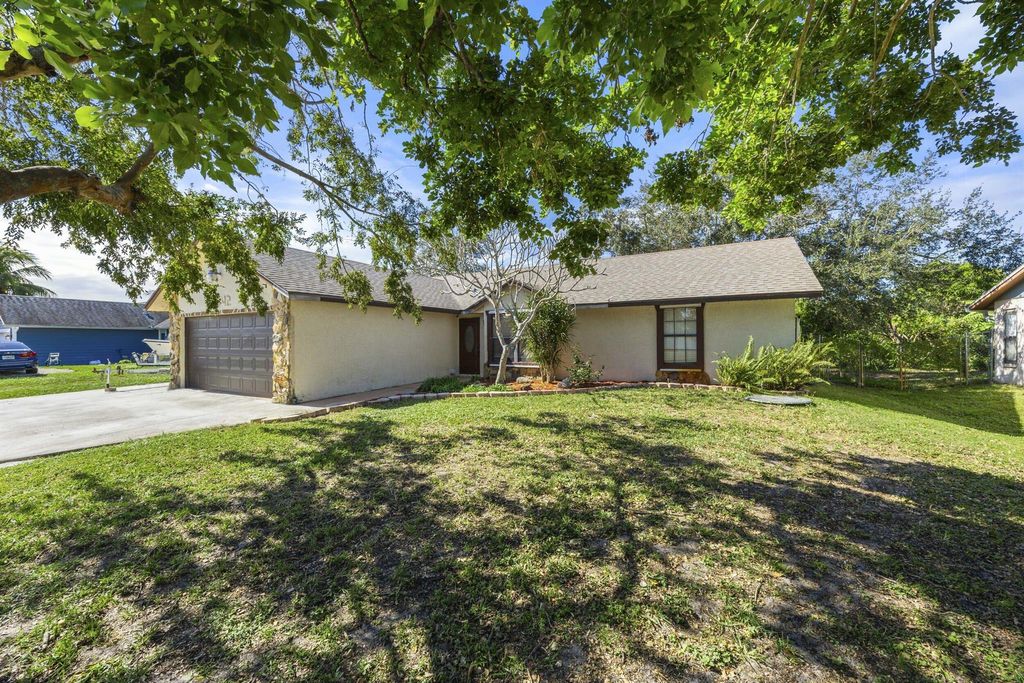 Photo of 2442 SW Lafayette Street, Port Saint Lucie, FL 34984 (MLS # R11092420)