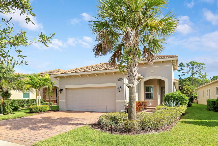 THIS HOME IS BRIMMING WITH CHARM & CHARACTER! Spacious 2BR+Den/2BA/2CG 'Casita' plan with private, fenced back yard. Some of the many special features include decorative glass entry front door, elegant lighting & fans throughout, upgraded window treatments, wallpaper accent, wood flooring in the master bedroom, murphy bed in the guest bedroom, front load washer & dryer, spacious fenced yard, quartz counters throughout, custom organizers in the master closet and more! Wood look tile runs through the main living areas. The spacious kitchen is fit for cooking enthusiasts and features 42'' wood cabinetry, quartz counters, center island, upgraded stainless steel appliances, breakfast bar seating, custom built storage center with drawers, pendant lighting, tiled backsplash and pantry closet.