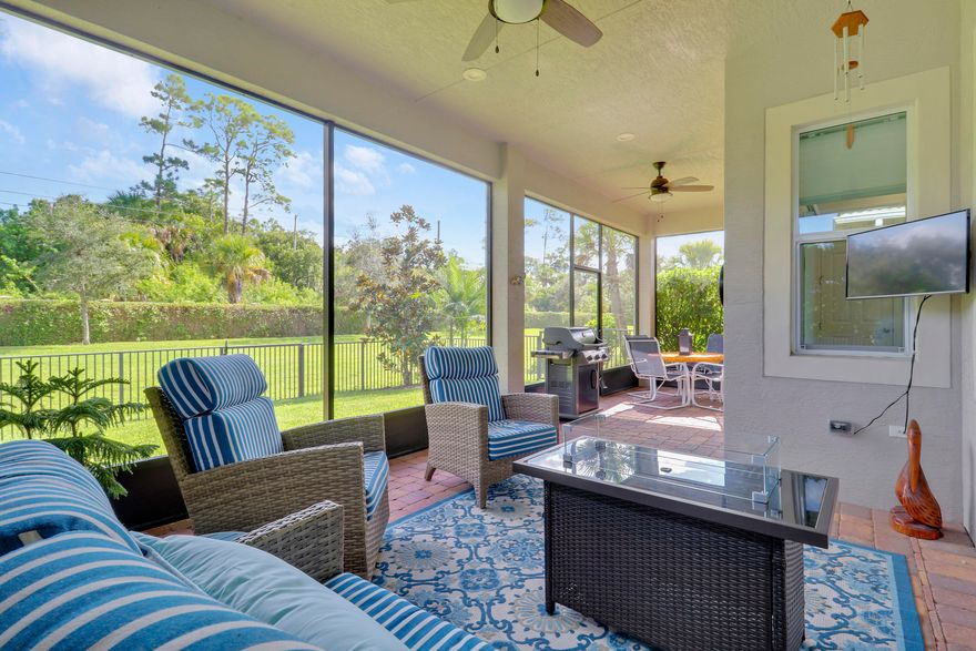 THIS HOME IS BRIMMING WITH CHARM & CHARACTER! Spacious 2BR+Den/2BA/2CG 'Casita' plan with private, fenced back yard. Some of the many special features include decorative glass entry front door, elegant lighting & fans throughout, upgraded window treatments, wallpaper accent, wood flooring in the master bedroom, murphy bed in the guest bedroom, front load washer & dryer, spacious fenced yard, quartz counters throughout, custom organizers in the master closet and more! Wood look tile runs through the main living areas. The spacious kitchen is fit for cooking enthusiasts and features 42'' wood cabinetry, quartz counters, center island, upgraded stainless steel appliances, breakfast bar seating, custom built storage center with drawers, pendant lighting, tiled backsplash and pantry closet. Retreat to the master suite, which overlooks the peaceful back yard and has wood flooring, spacious ensuite with dual vanities, tiled shower and a walk-in closet with fantastic custom organizers. The second bedroom is fit with a versatile murphy bed and has direct access to the second bathroom, which is also accessible through the hallway. The office/den is perfect as a flex room or home office. Laundry room with upgraded front load washer & dryer, cabinetry for storage and utility sink. Enjoy bird watching in the serene back yard from your spacious screened & covered patio. The fully fenced yard is ready for your furry family members! Storm preparation is a breeze with IMPACT GLASS WINDOWS & DOORS throughout, also providing energy efficiency. Verano is an amenity rich community with a 27 court pickleball facility, walking paths, indoor and outdoor pools, multiple fitness centers, sauna, dog park, tennis courts, social clubhouse and so much more! HOA dues include basic cable, internet, lawn care, alarm monitoring, common area maintenance and access to the amenity centers. For avid golfers, there is a cart path leading to the PGA Golf Club (membership is optional and availability varies). This community truly has something for everyone! Come experience resort style living - call today to view!