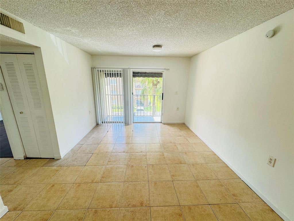 Photo of 1068 N BENOIST FARMS Road #302, West Palm Beach, FL 33411 (MLS # B26059945)