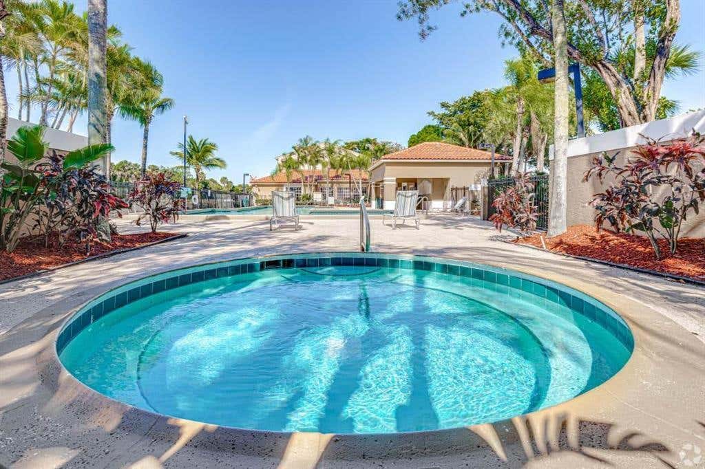 Photo of 1068 N BENOIST FARMS Road #302, West Palm Beach, FL 33411 (MLS # B26059945)