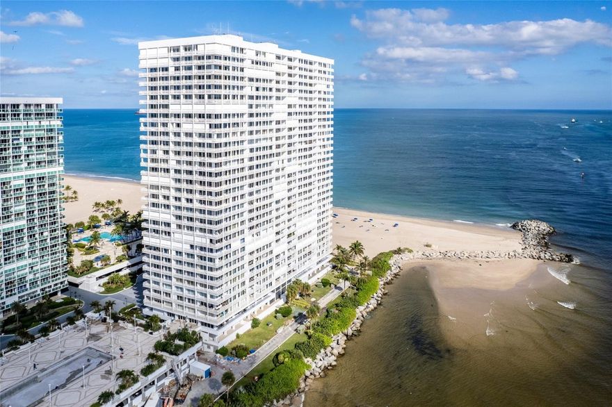 Ft Lauderdale Beachfront Escape Awaits! Wake up to a symphony of ocean breezes, and the ever-changing spectacle of the sea, all from the comfort of your fully furnished condo. A stunning oasis boasts breathtaking panoramic ocean views that stretch from your expansive windows, captivating you from every corner. Unleash your inner chef in the modern kitchen, a culinary playground adorned with granite counters & stainless appliances. Marvel at the vibrant inlet, a daily parade of boats dancing on the waves, and the captivating cityscape from your private wrap-around balcony. Retreat to a spacious principal bedroom, your personal sanctuary featuring a luxurious en-suite bathroom and walk-in closet. Step to the sand or dive into refreshing waters of 2 sparking pools. Leasing options available.