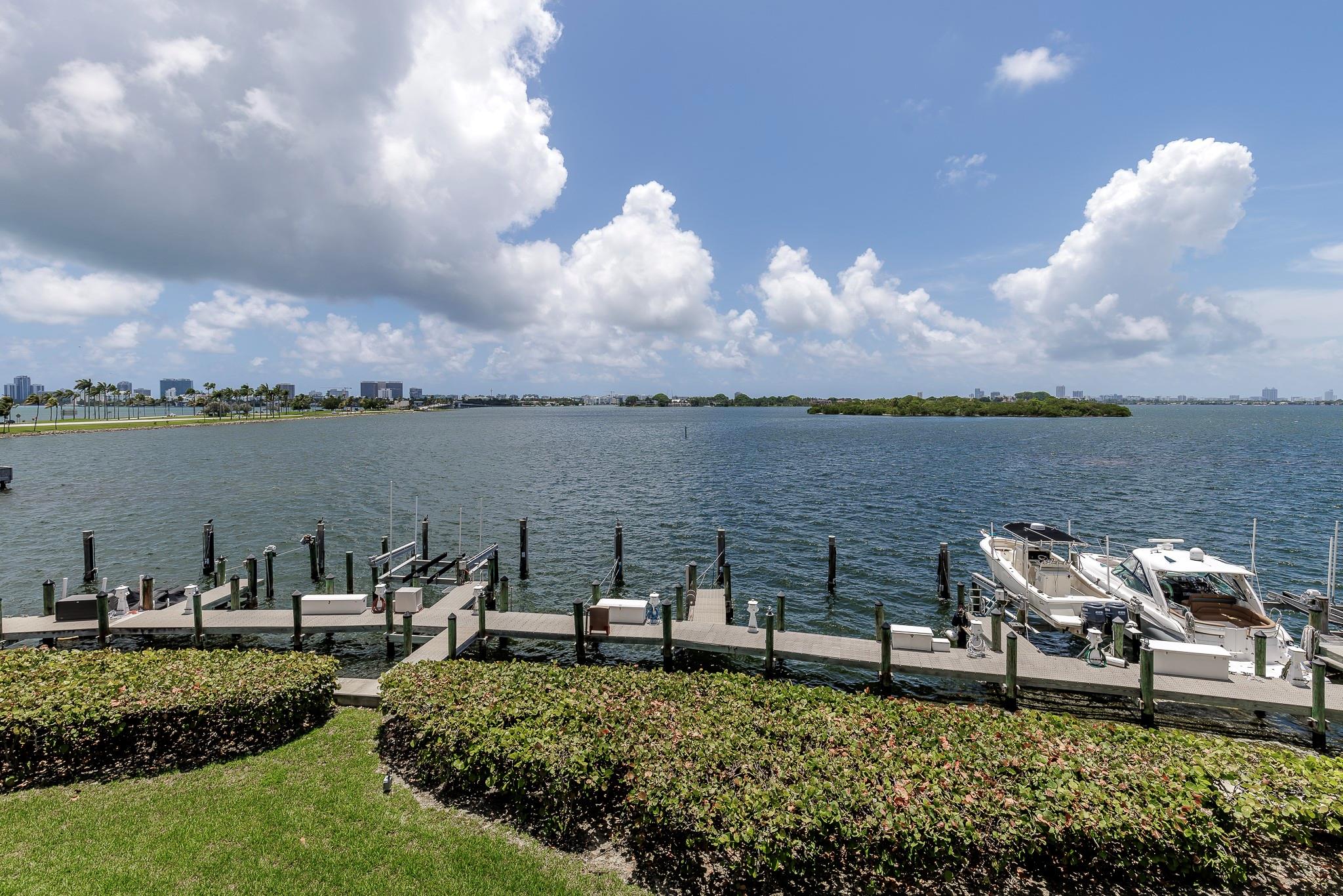 A gated boutique building with some of Miami’s most stunning bay views. Wake up to sunrise and sea breezes on your 50-ft terrace overlooking a private marina and Biscayne Bay. This fully renovated 2-bed + office, 2-bath home features a designer kitchen, custom built-ins, and a spacious living/dining area with panoramic water views. The primary suite offers a walk-in closet, luxe bath with soaking tub, glass shower, and private water closet. Porcelain floors, designer lighting, and hurricane-impact windows/doors throughout. Enjoy top amenities: bayfront heated pool, gym, sauna, BBQ area, kayak & bike storage, and two assigned parking spots.
Bonus: A large deeded private dock—a rare gem for boaters. This isn’t just a condo, it’s vacation living year-round.